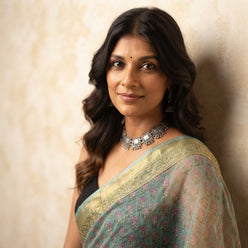 Nandita Das wearing a sea green Handblock Kota Doriya saree with small butti prints and a golden border.