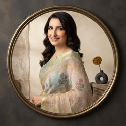 Tisca Chopra wearing a sea green handblock Kota Doriya saree with golden borders in a professional portrait.